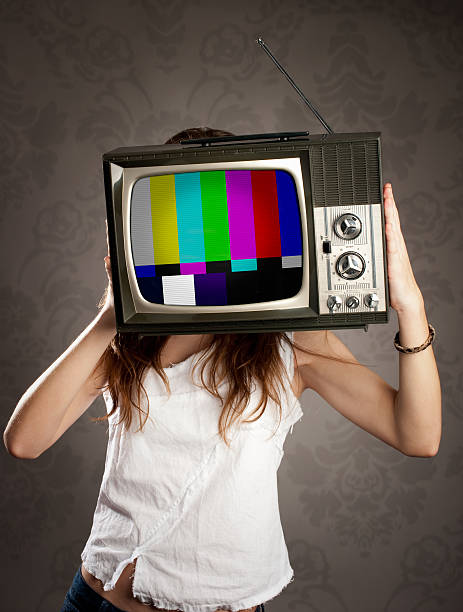 istock woman holding old television on her head 178484616