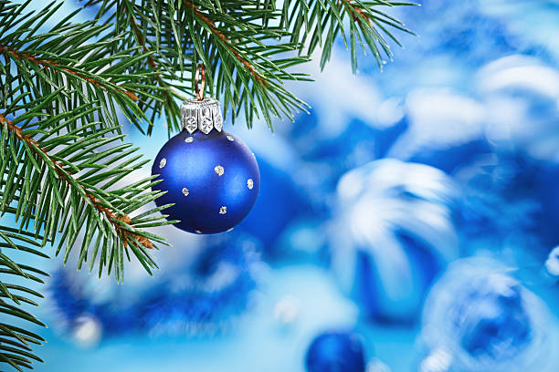 istock Christmas ball on blue spruce branch over blurred background 178485252
