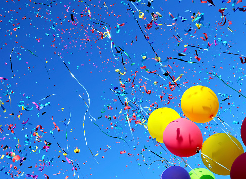 multicolored balloons and confetti in the city festival #6