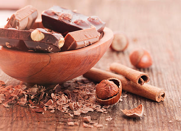 Chocolate pieces  with cinnamon stick stock photo