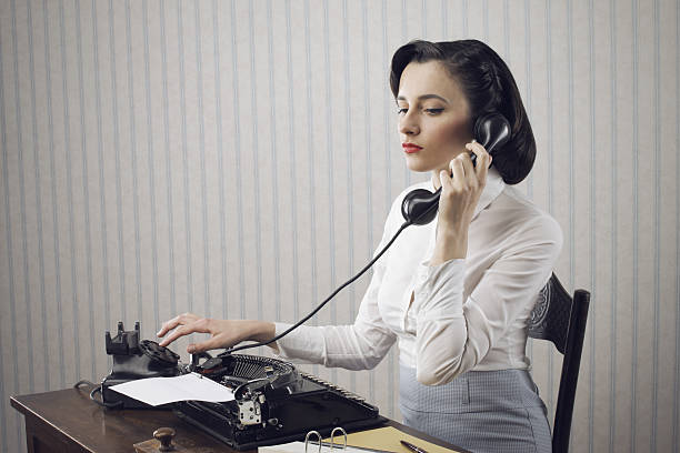 istock Woman talking on phone at desk 178485828