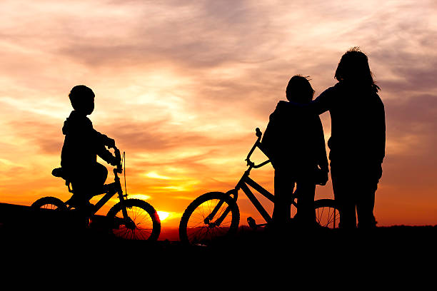istock Mom and kids bond at sunset. 178485909