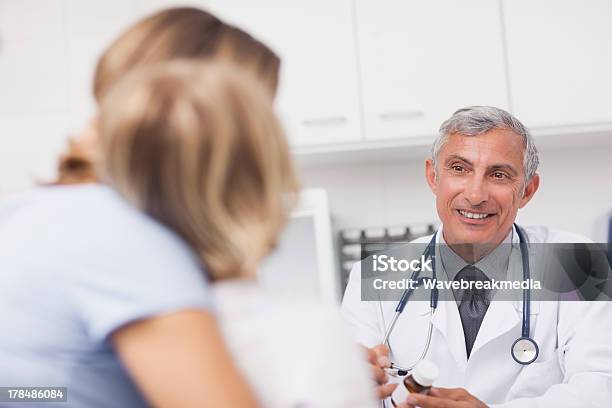 Doctor Holding A Drug Box Stock Photo - Download Image Now - 30-39 Years, 50-59 Years, Adult