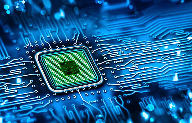 Green microchip set in a blue printed circuit board microchip integrated on motherboard computer part stock pictures, royalty-free photos & images