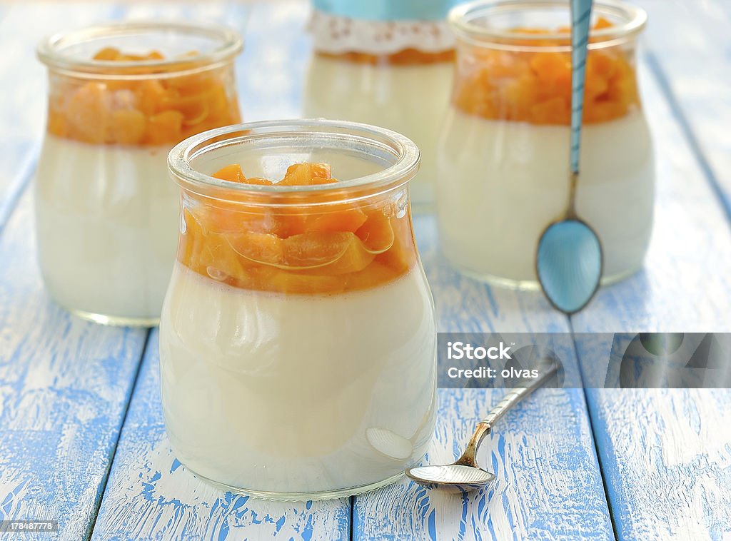 Panna cotta with fruit Panna cotta with fruit on a blue table Backgrounds Stock Photo