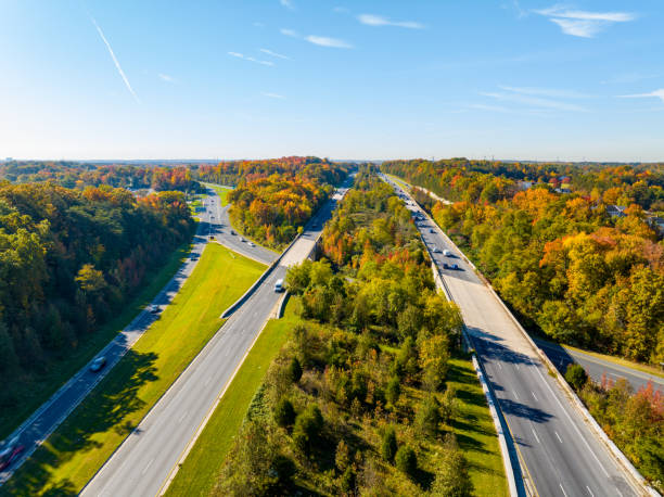 Aerial drone photo Baltimore Washington Parkway with colorful fall foliage Aerial drone photo Baltimore Washington Parkway with colorful fall foliage laurel maryland stock pictures, royalty-free photos & images