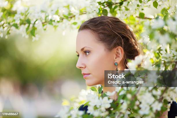 Beautiful Woman In A Spring Garden Stock Photo - Download Image Now - 30-34 Years, 30-39 Years, Adult
