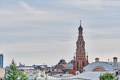 Roofs of buildings in downtown Kazan, Russia. Bell tower of Epiphany Cathedral.