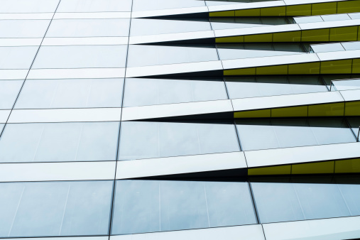 Abstract image of windows on a office building with angular yellow features