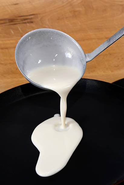 istock Pancake batter is poured into pan from the ladle 178488972