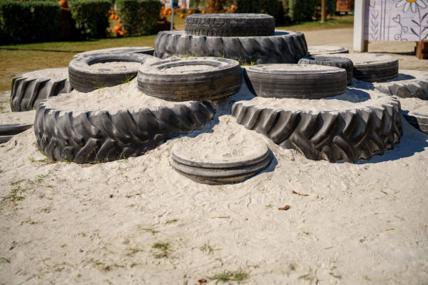 istock Old tires on a childrens playground sandpit 1784891098