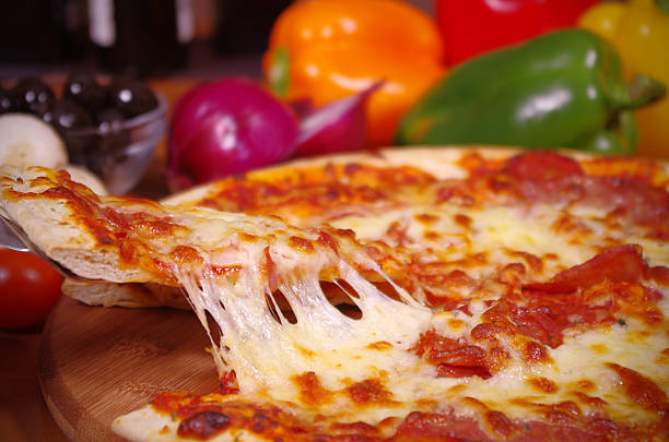 istock Serving a Slice of Hot Pizza 178491228