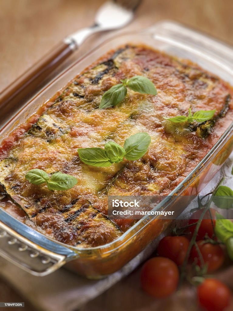 zucchinis parmesan "zucchinis parmesan traditional italian recipe,vegetarian food" Basil Stock Photo