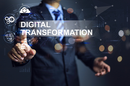 businessman hand touch on digital transformation to accept or adapt the industries or factory in digital age with data information to increase the productivity and process improvement