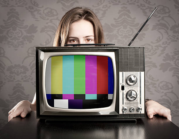 istock woman with old retro tv 178491765