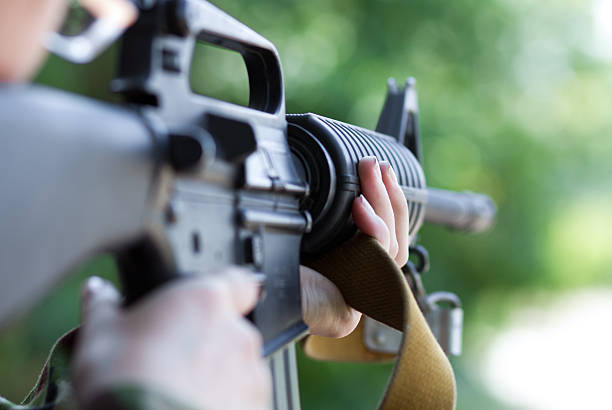 istock Female soldier shooting with a gun 178491795