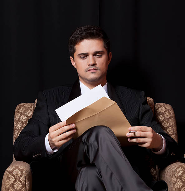 istock Man with file sitting in vintage armchair 178492189
