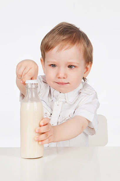 istock The boy with bottle of milk 178493480