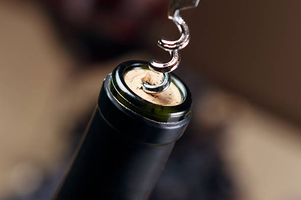 istock Opening bottle of wine with corkscrew 178493548