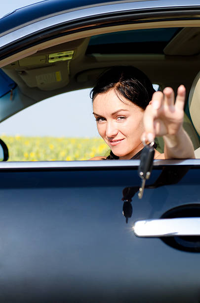 istock Female driver offering her car keys 178493751