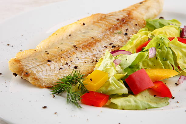 Fish fillet with vegetables stock photo