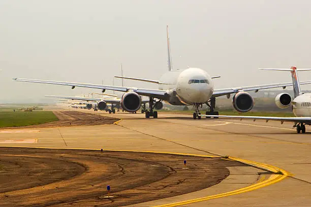 Commercial airplanes in line to take off