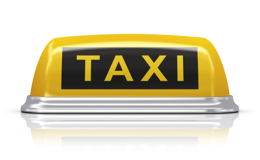 Yellow taxi car roof sign isolated on white background with reflection effect. See also: