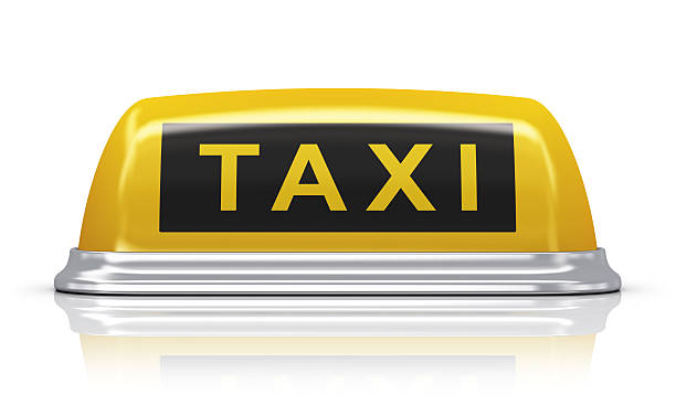 Yellow taxi car sign Yellow taxi car roof sign isolated on white background with reflection effect. See also: taxi photos stock pictures, royalty-free photos & images