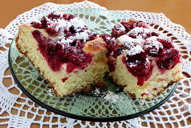 istock raised pie with cherries and sugar powder 178494625
