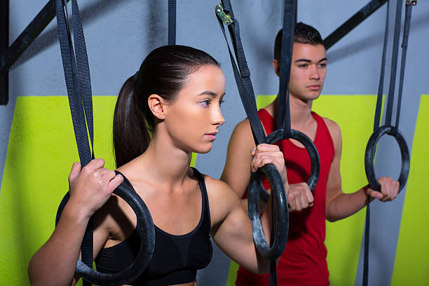 gym dip ring man and woman relaxed after workout