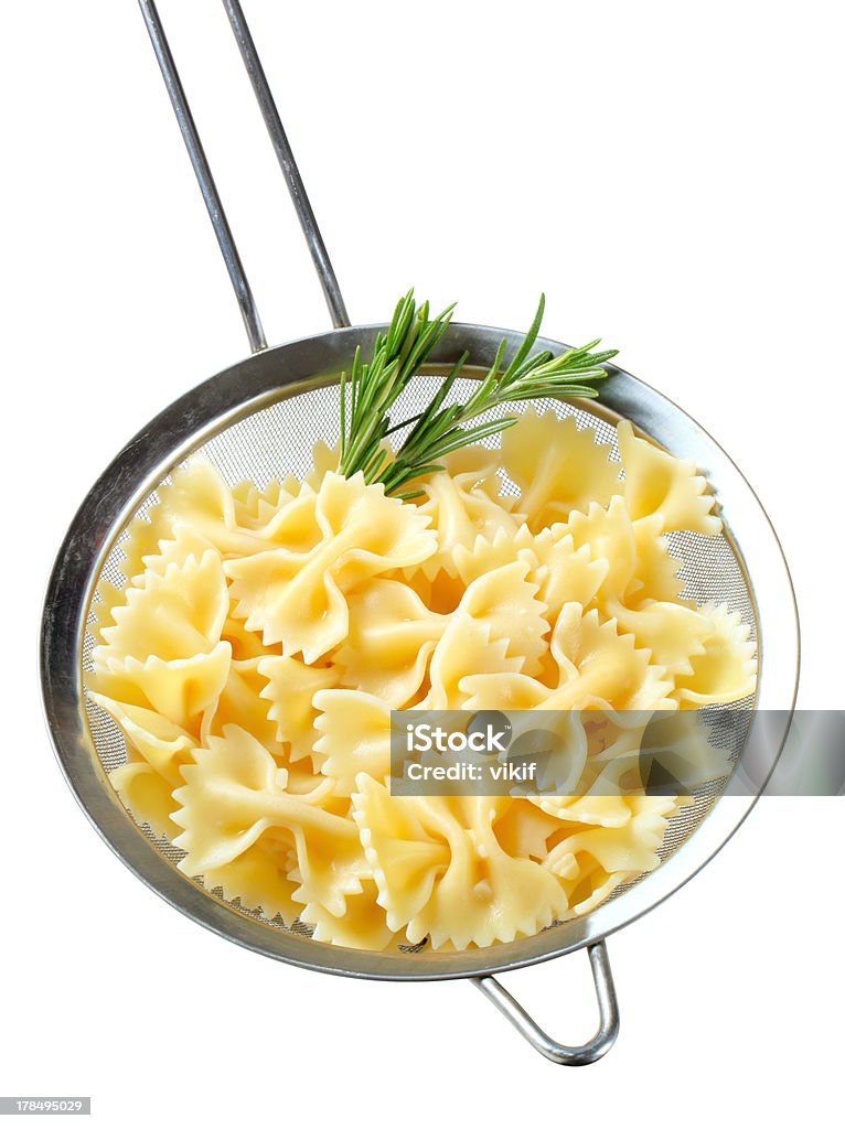 Farfalle in un colabrodo - Foto stock royalty-free di Bollito