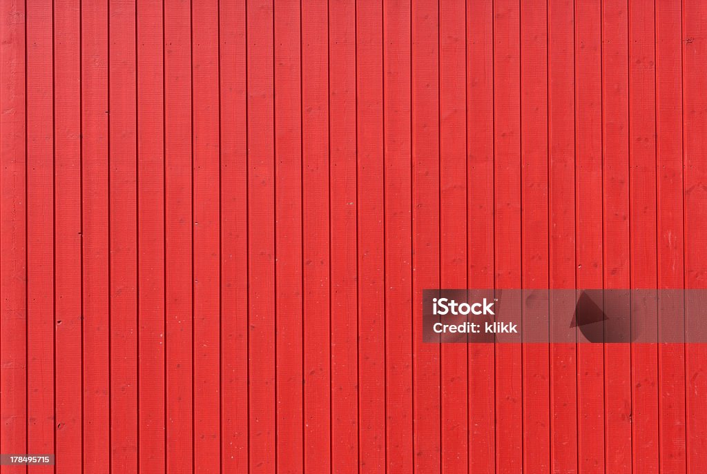 Red wooden wall Background image of a wooden wall painted in bright red color Architectural Feature Stock Photo