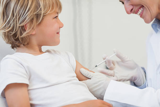 istock Doctor giving to a child an injection 178495807