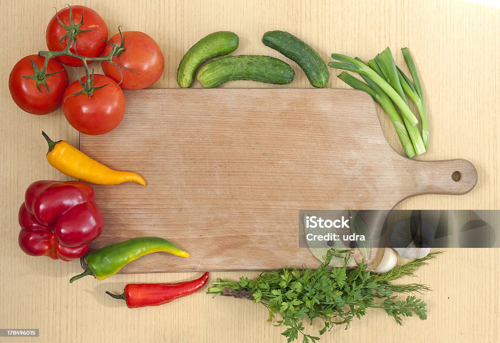 Vegetables herbs and spices Vegetables and spices border and empty cutting board Backgrounds Stock Photo