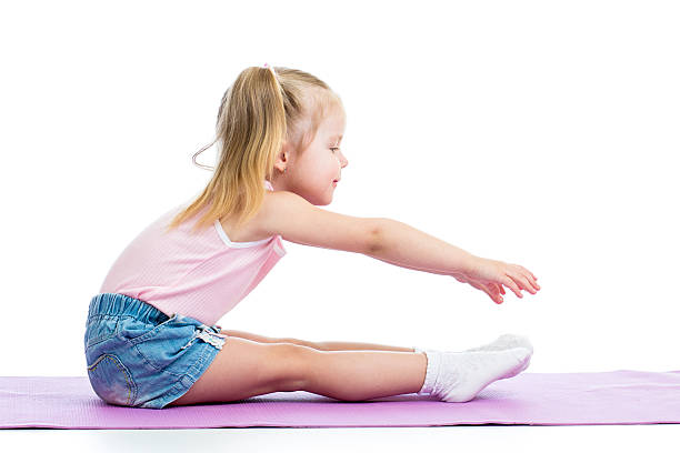 istock Kid girl doing fitness exercises 178496200