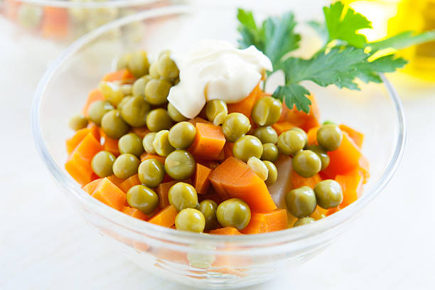 Salad vegetarian with canned peas and boiled vegetables close-up. Healthy food