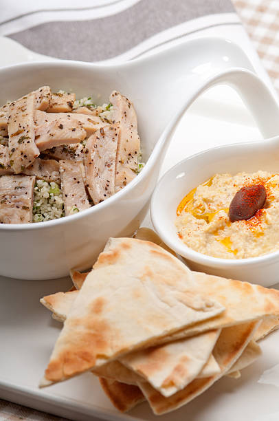 istock chicken taboulii couscous with hummus 178498457