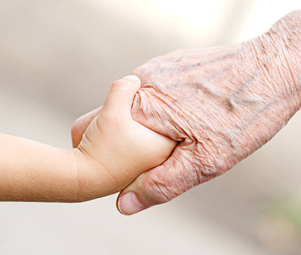 istock hand old woman and child 178498575