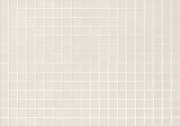 istock Cream light ceramic wall and floor tiles mosaic background in bathroom and kitchen. Design pattern geometric with grid wallpaper texture decoration pool. Simple seamless abstract surface clean. 1784986694