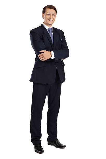 Attractive businessman standing with arms crossed stock photo