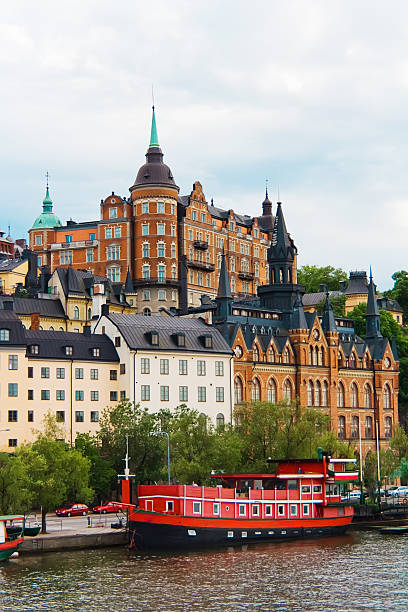 istock Red boat near city buildings 178498955