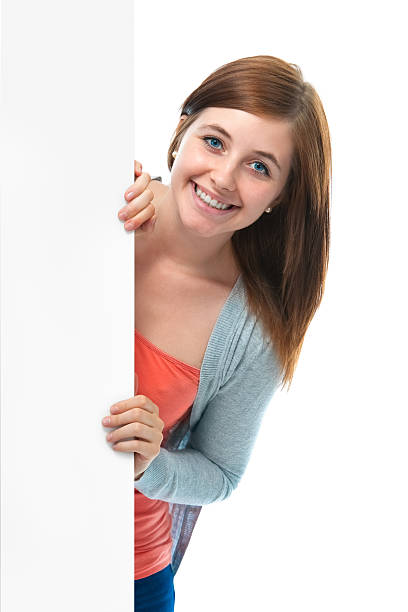 istock teenage girl holds a blank board 178498986