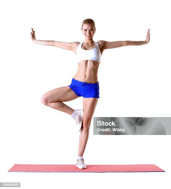 Attractive Blonde Posing On Mat In Studio Stock Photo - Download Image Now - Active Lifestyle, Activity, Adult