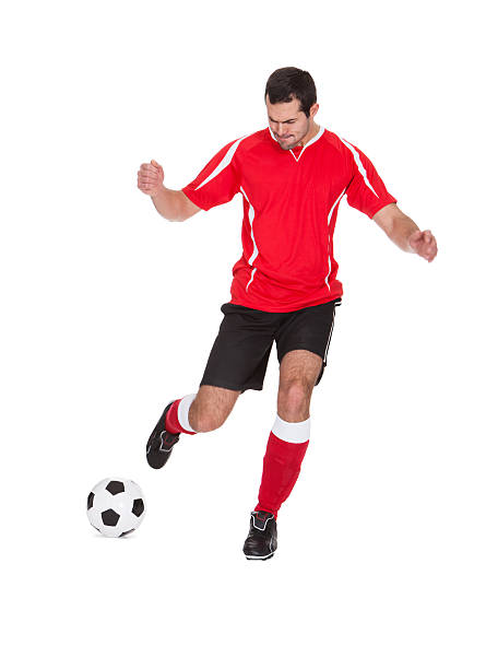 istock Professional soccer player kicking ball 178499297