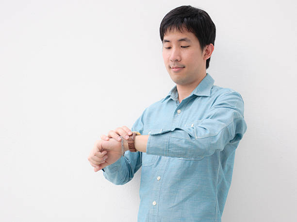 istock asian man look his watch 178499379