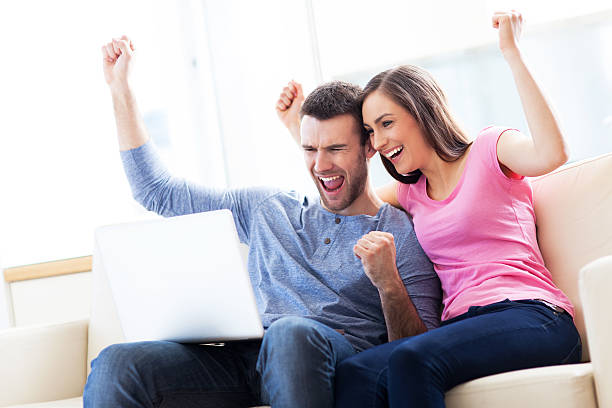istock Excited couple with laptop 178499385
