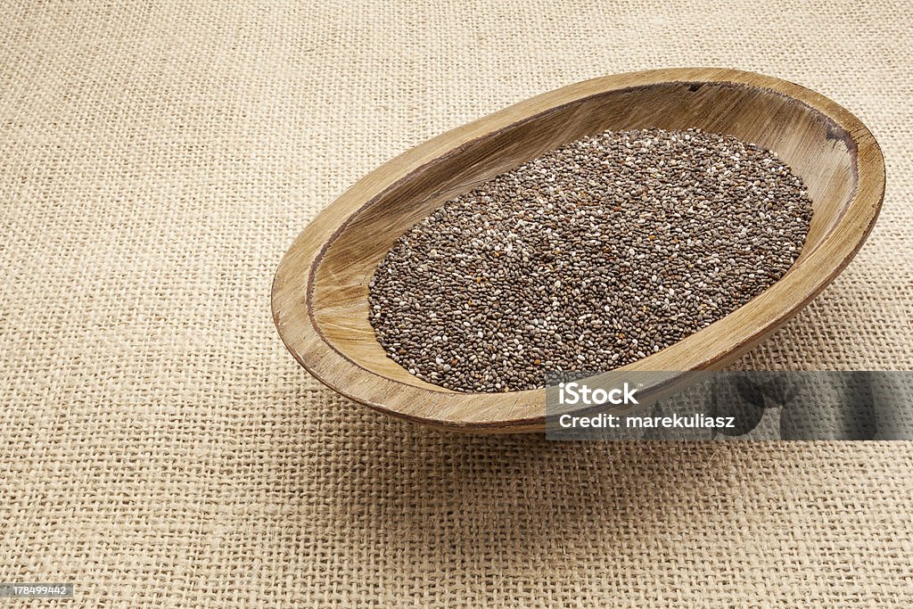 chia seeds in bowl chia seeds in a rustic oval wood bowl against canvas Antioxidant Stock Photo