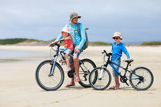 istock Father and kids riding bikes 178500128