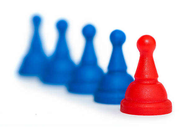 istock Red and blue game pawns white isolated 178500284