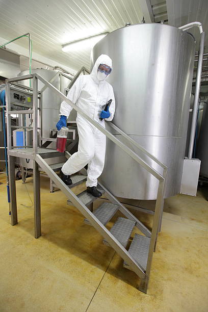 istock scientist with probe and tablet walking down the stairs 178500599